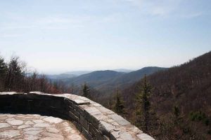 a view of the mountains from a stone overlook