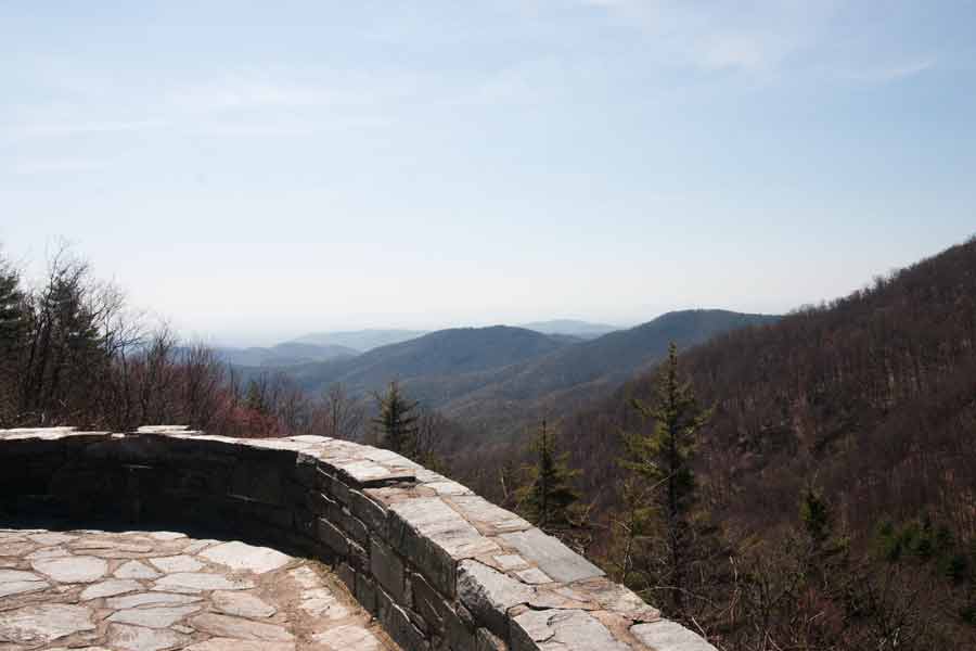 a view of the mountains from a stone overlook