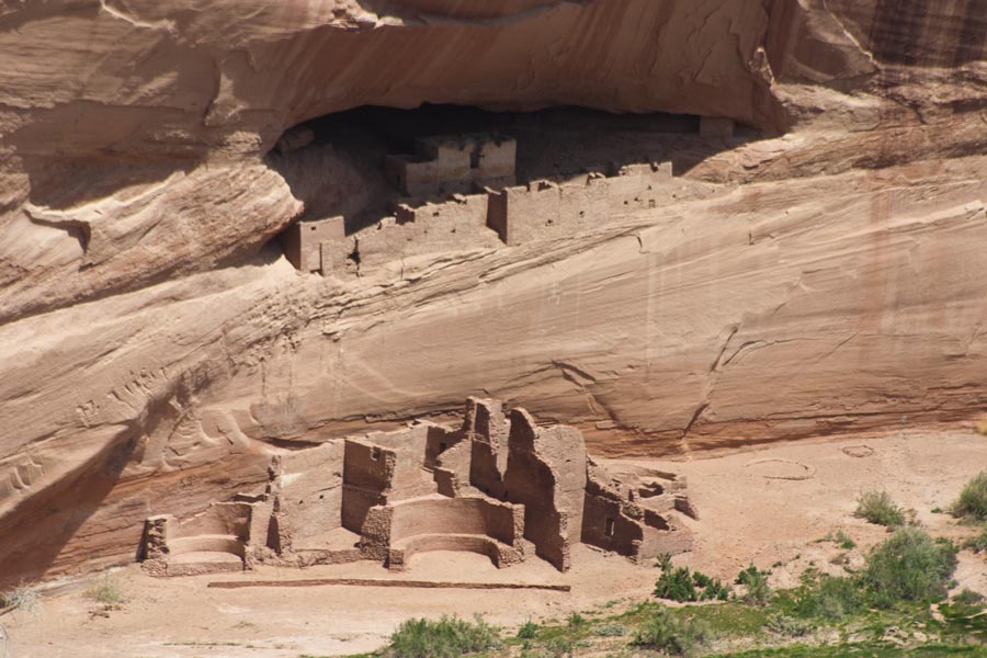remains of dwellings below and in the cliff