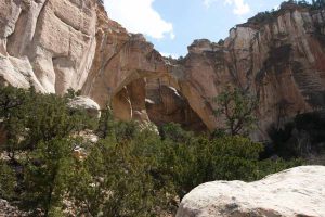 an arch in a canyon wall