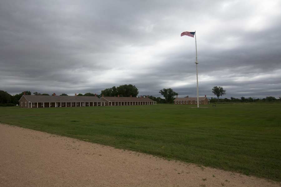The American flag flies in front of the fort.