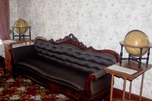 couch with a globe on either side