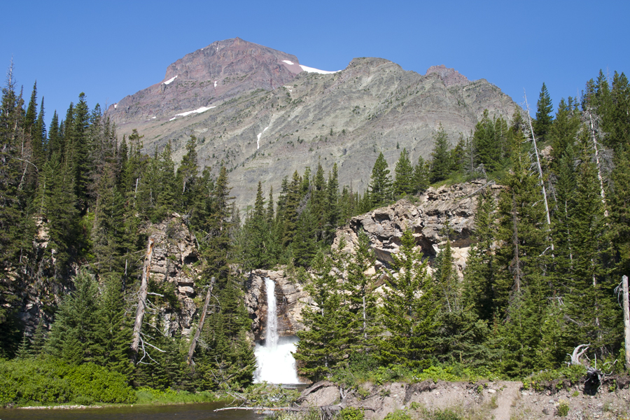 waterfalls with mountain behind