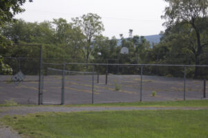 neglected tennis and basketball courts