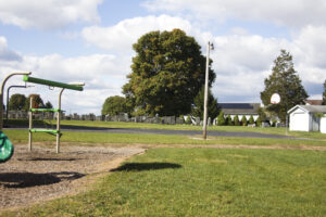 basketball court beside a cemetery