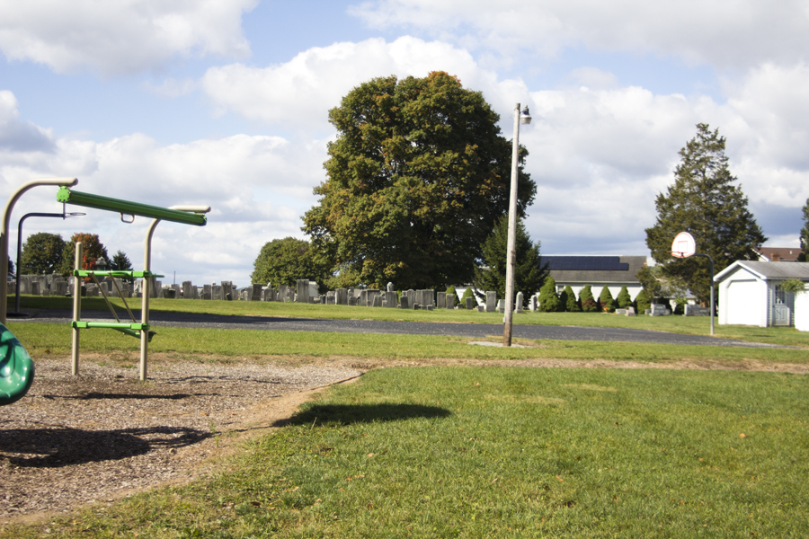 basketball court beside a cemetery