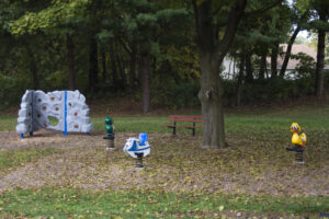 bouncies and a rock climbing wall and bench