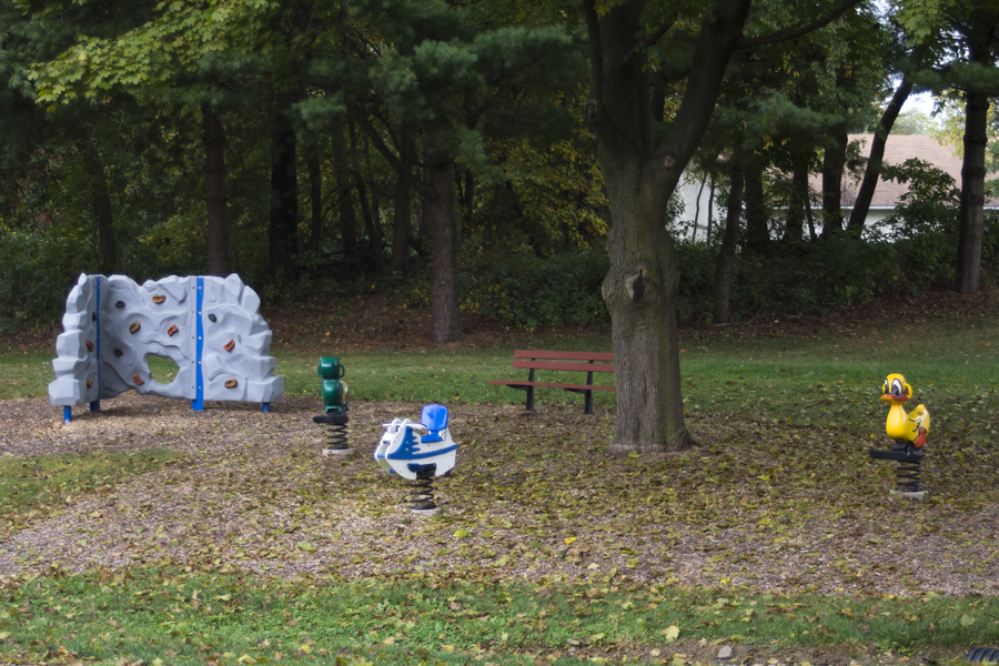 bouncies and a rock climbing wall and bench