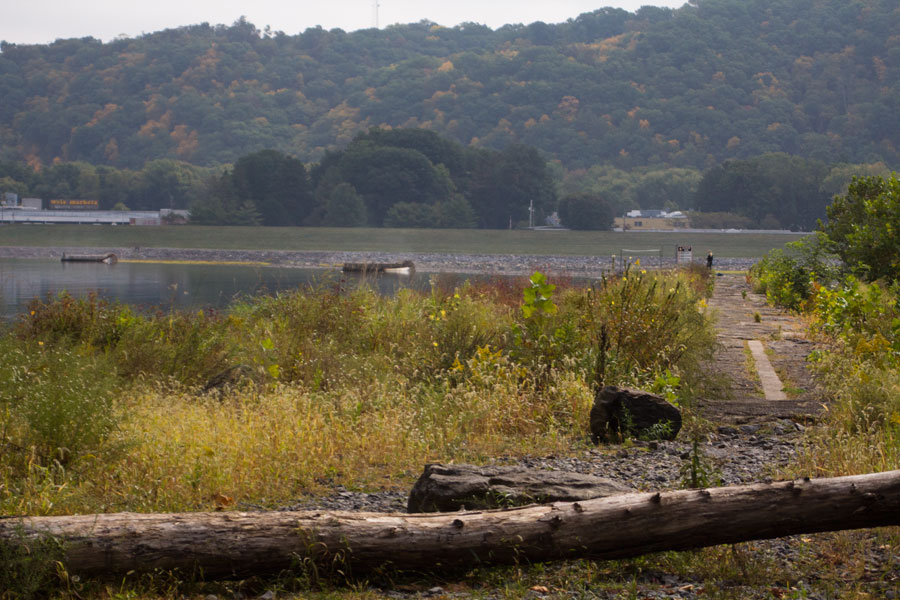 pathway to dam along river's edge