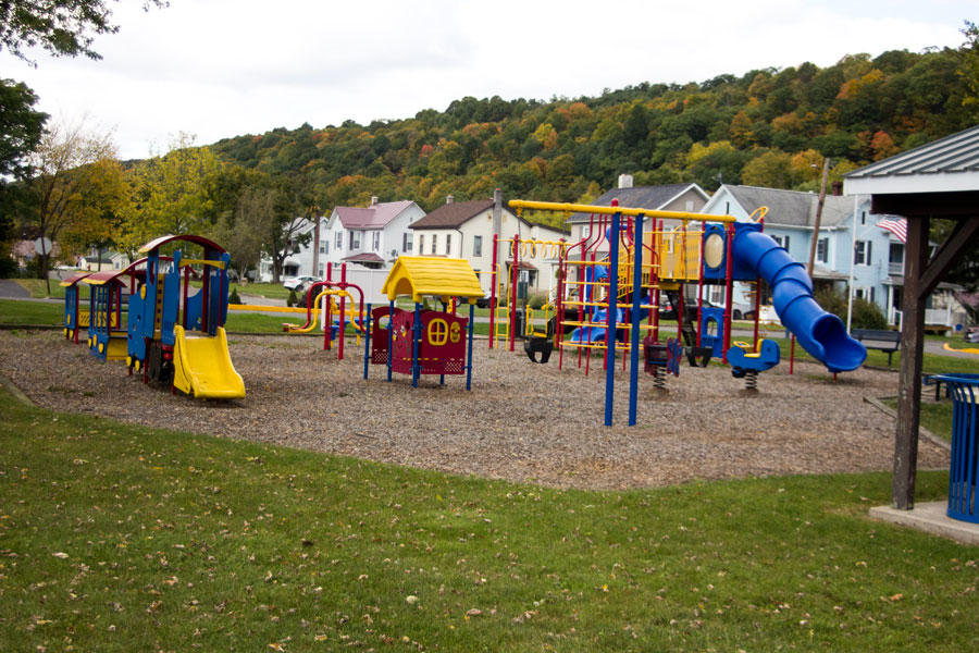 playground including slides, swings, bouncies, and a play train