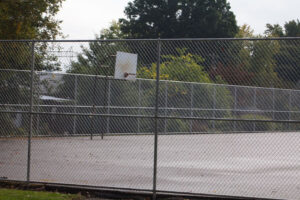 basketball court behind fence