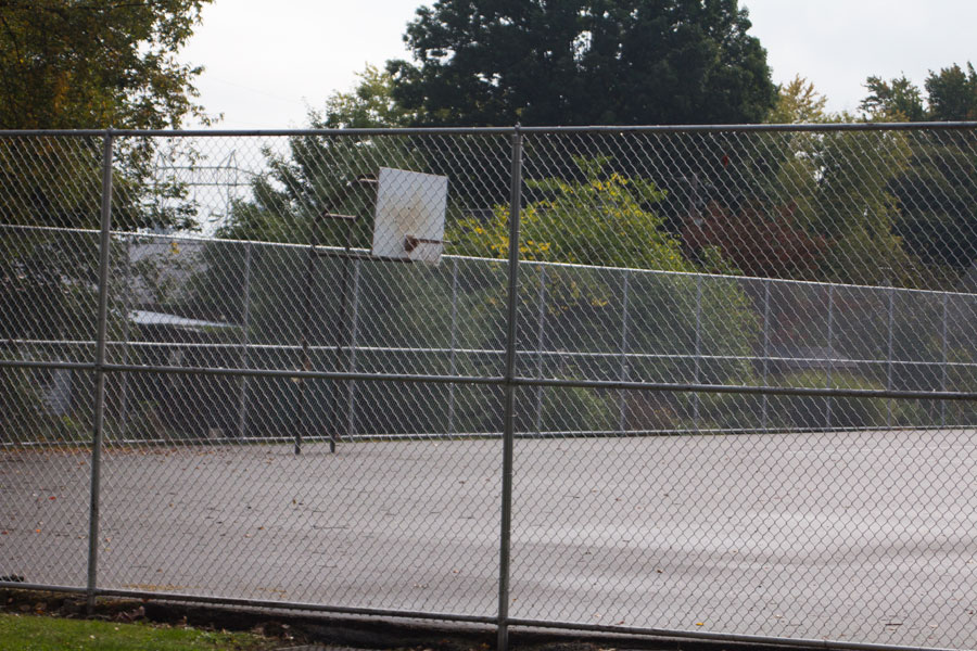 basketball court behind fence
