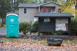 port-a-potty and bulletin board