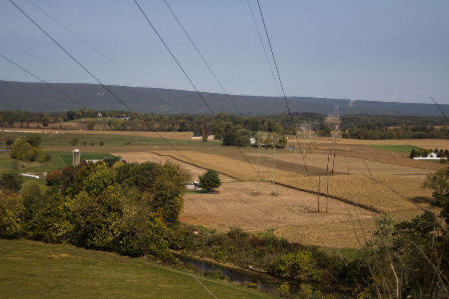 power lines provide view of farmland below