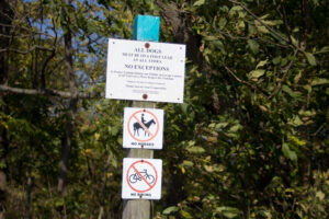 dogs on leash sign, no horses sign, and no bikes sign
