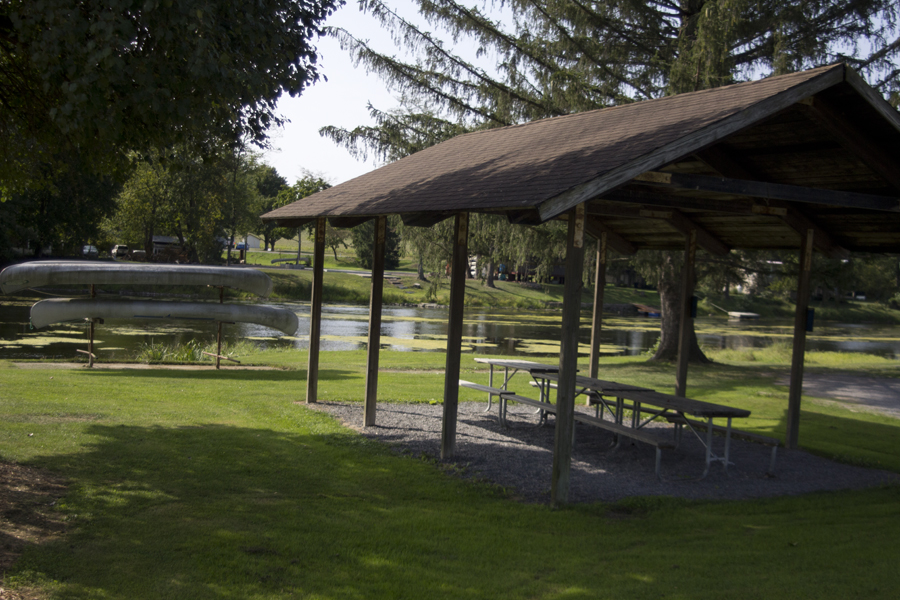 small pavilion with three picnic tables