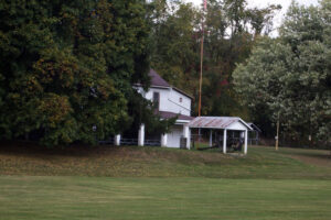 a pavilion and a cannon behind a house