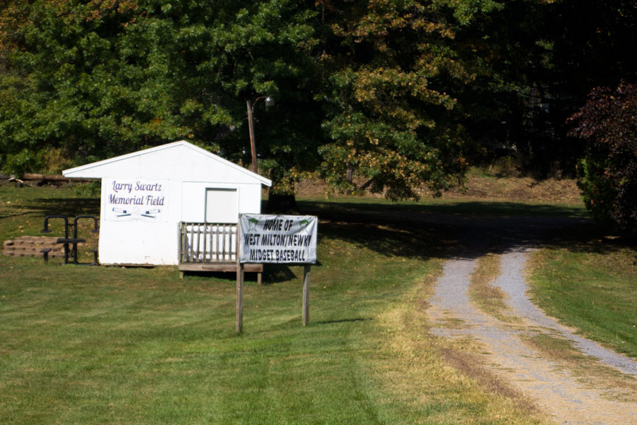 signs for Larry Swartz Memorial Field and Home of West Milton Midget Baseball