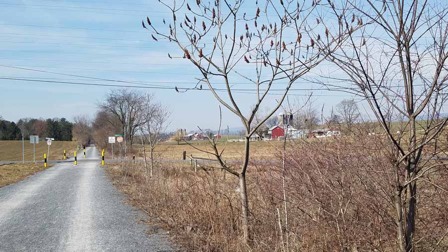 two farms beside the trail