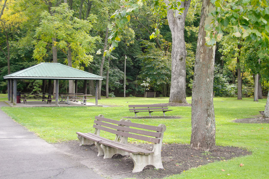 benches and pavilion with four picnic tables