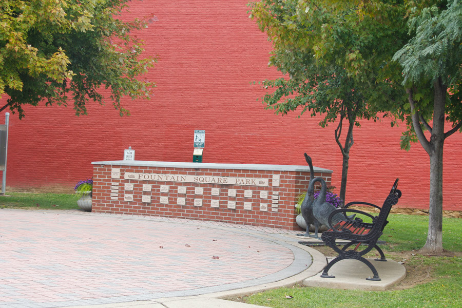 Fountain Square Park sign in a brick wall