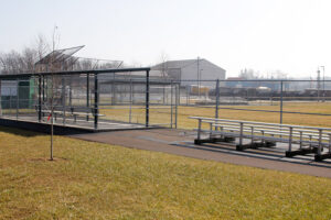 dugout, bleachers, and field