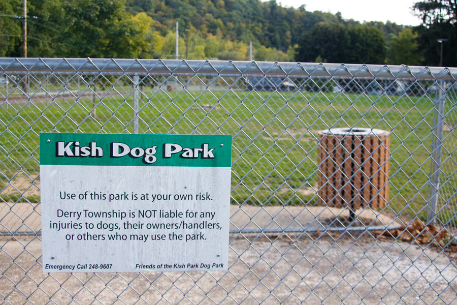 Kish dog park sign and trash can