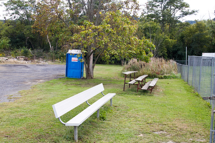 bench and three tiered bleachers