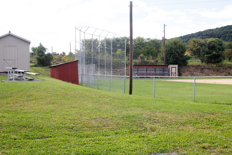 three tiered bleachers beside ball field