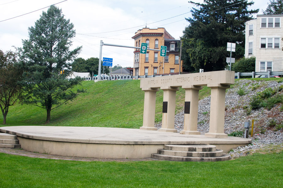 stage with "Mifflin County Veterans Memorial" on a sign above it