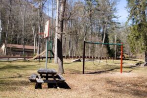 swings, slide and basketball hoop