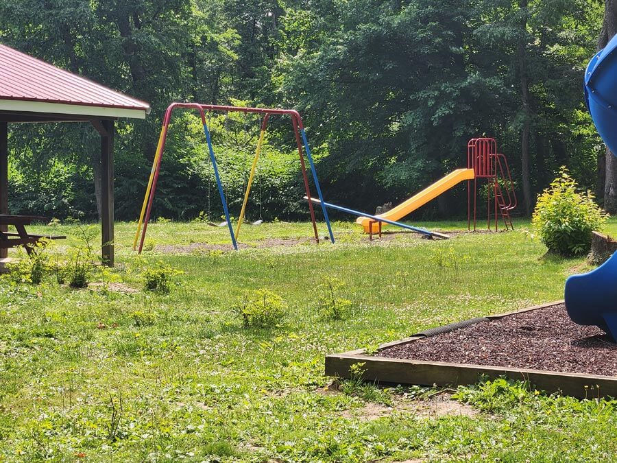 swings, slide, and a see-saw