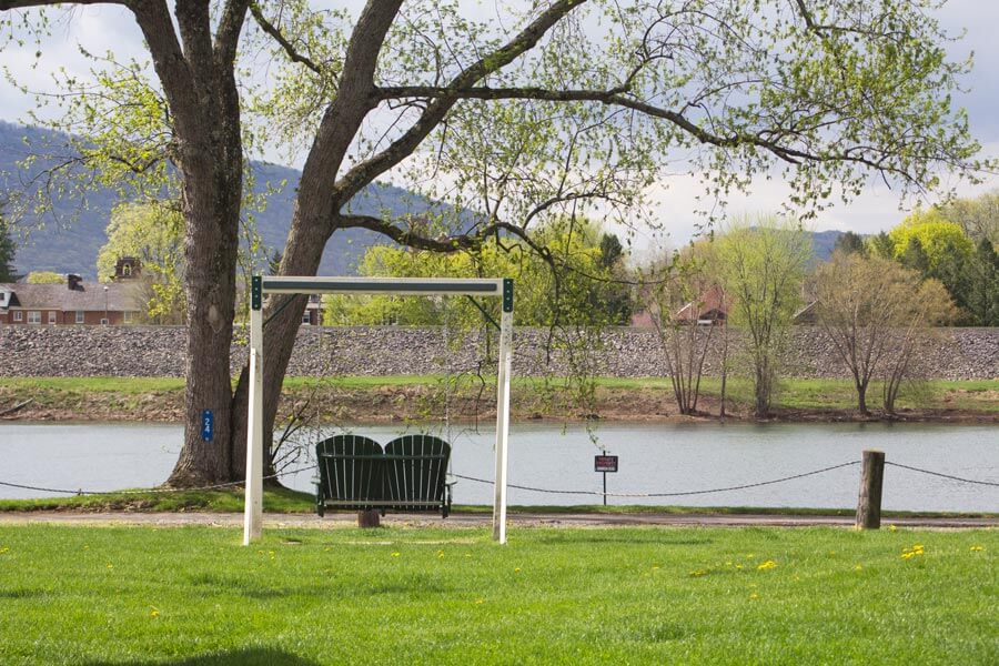 bench swing by river