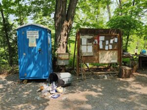 port-a-potty and bulletin board