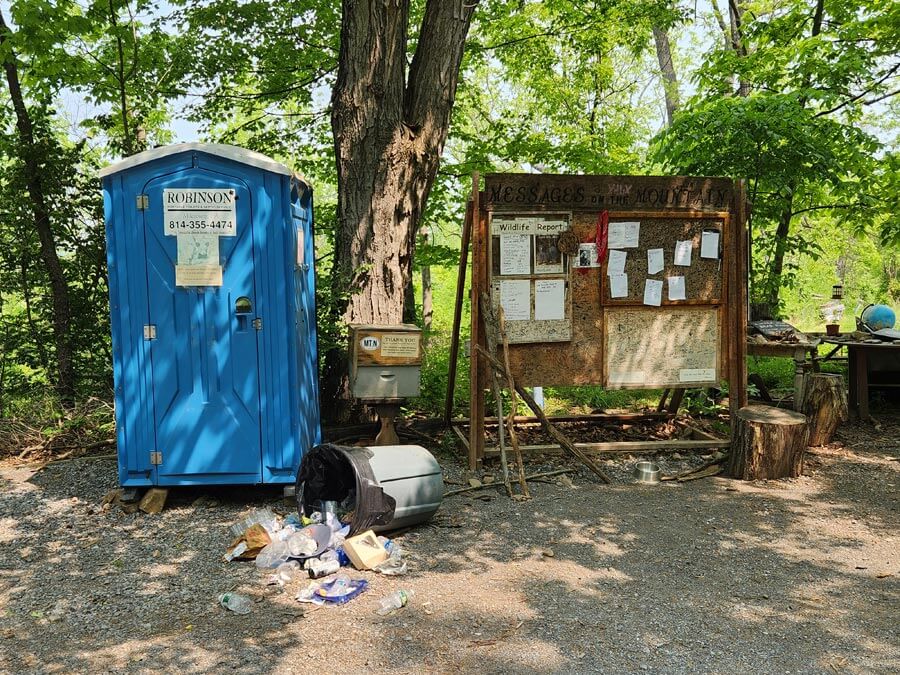 port-a-potty and bulletin board