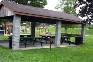 pavilion with picnic tables and grill