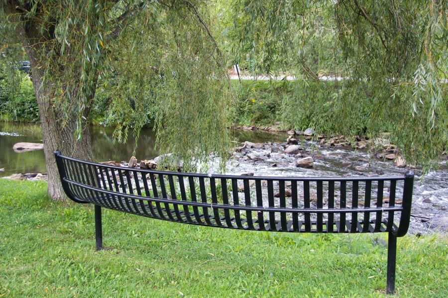 bench beside stream