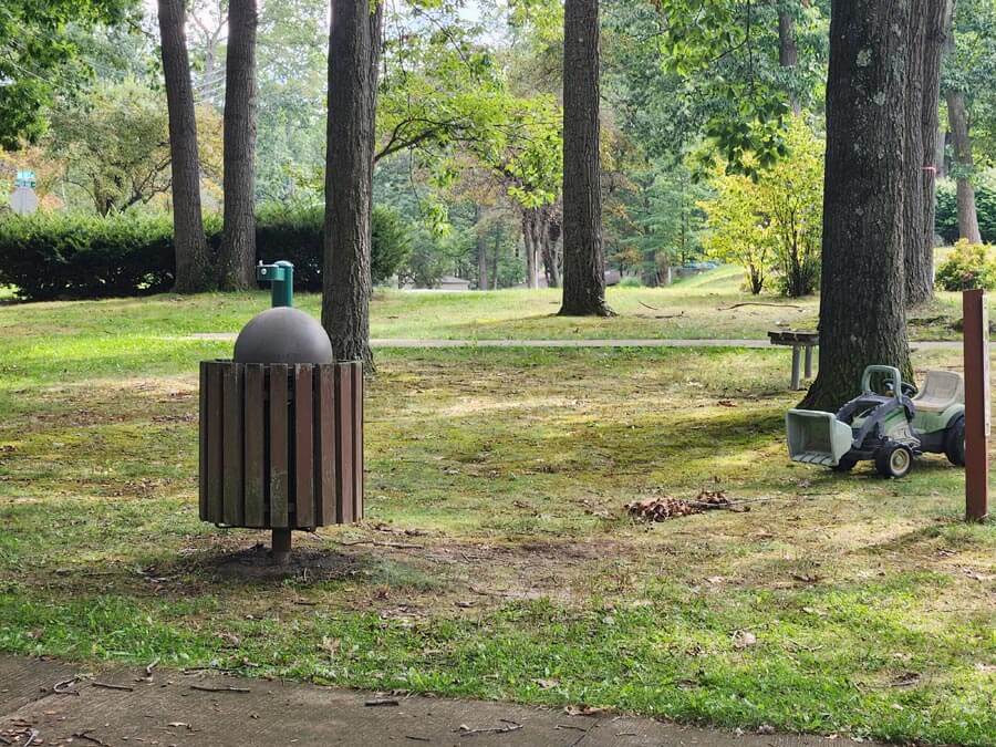 trash can, water fountain, and bench.