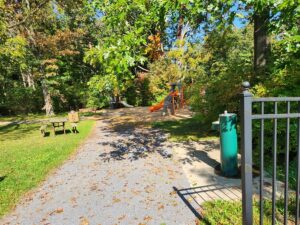 water fountain, playground, and picnic table.