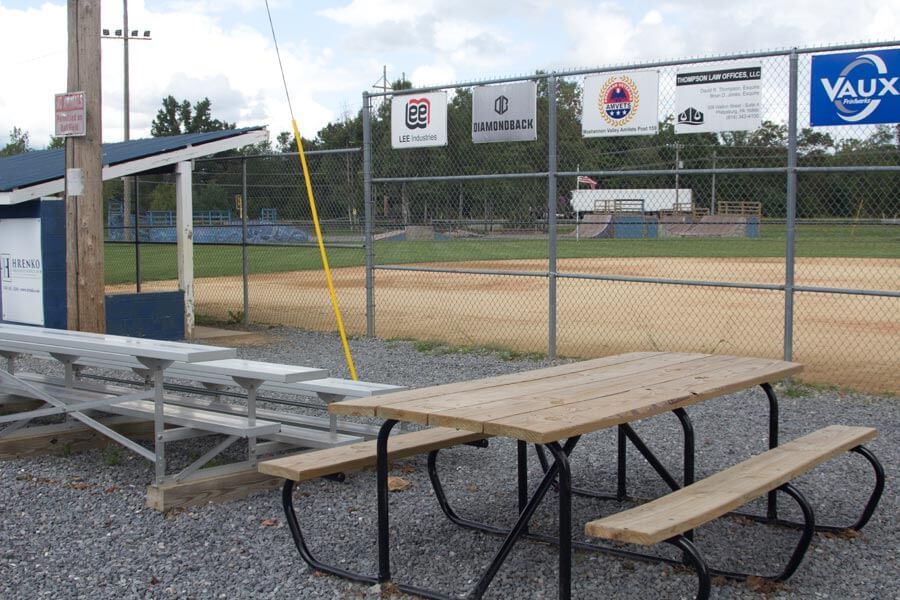 picnic table beside bleachers