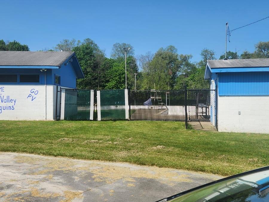 swimming pool behind fence