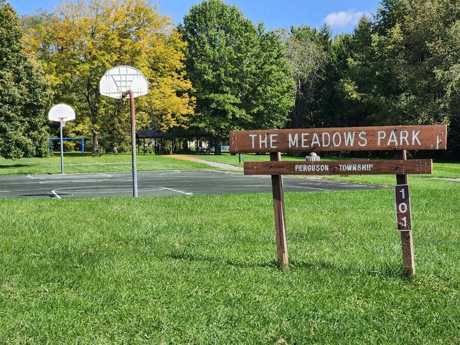 park sign and basketball court