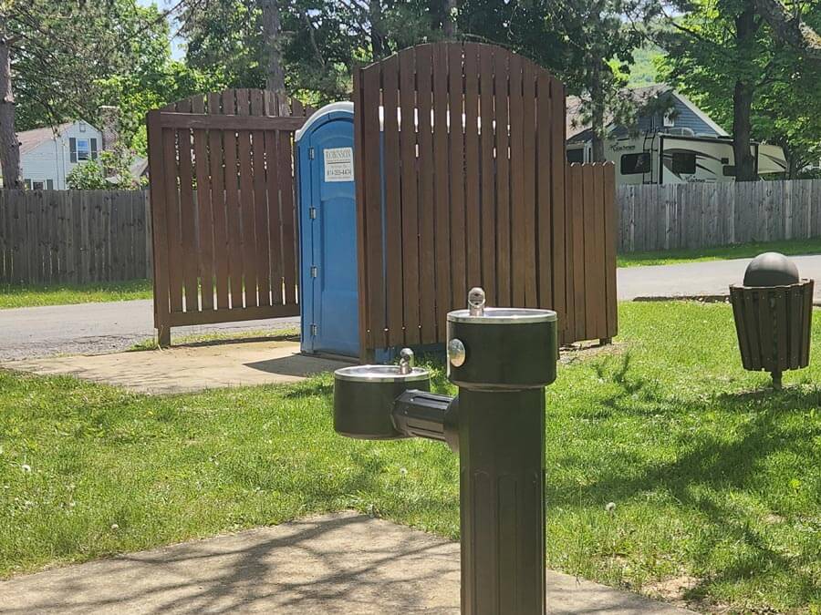 water fountain and port-a-potty.