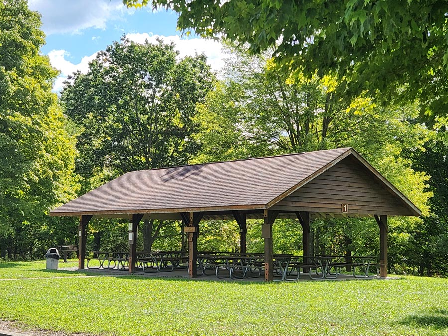 large pavilion with picnic tables.
