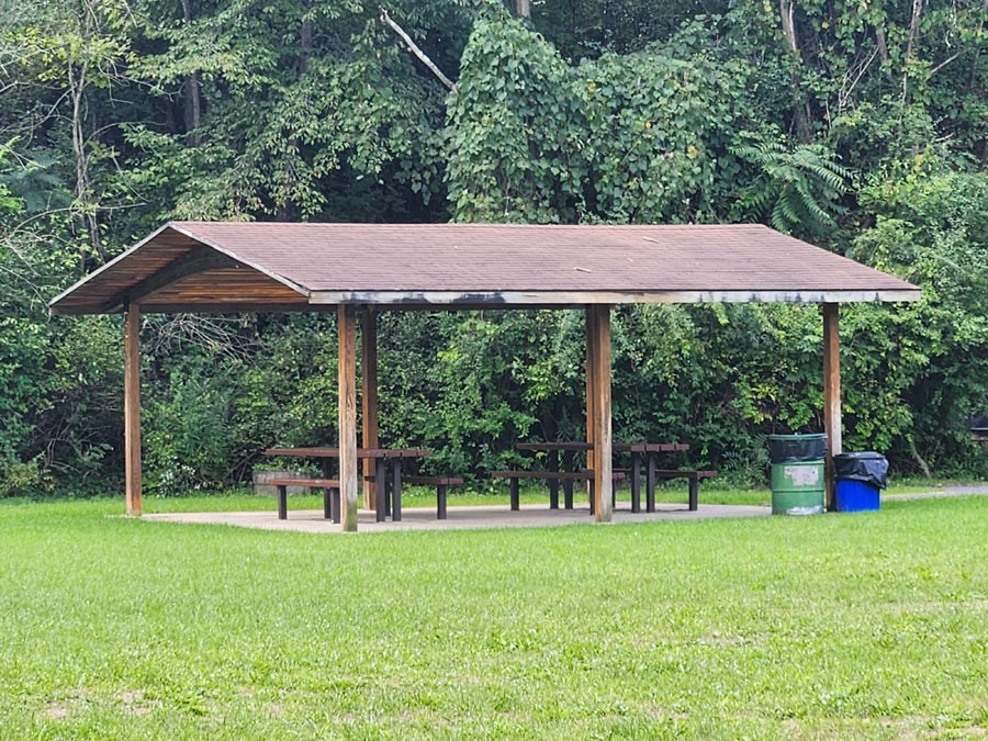 pavilion with two picnic tables.
