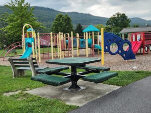 picnic table by playground.