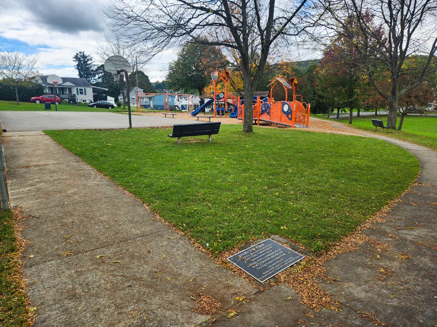 sidewalk, playground, and basketball court.