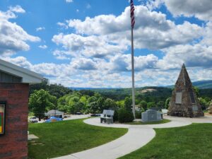 stone pyramid with plaques on it.
