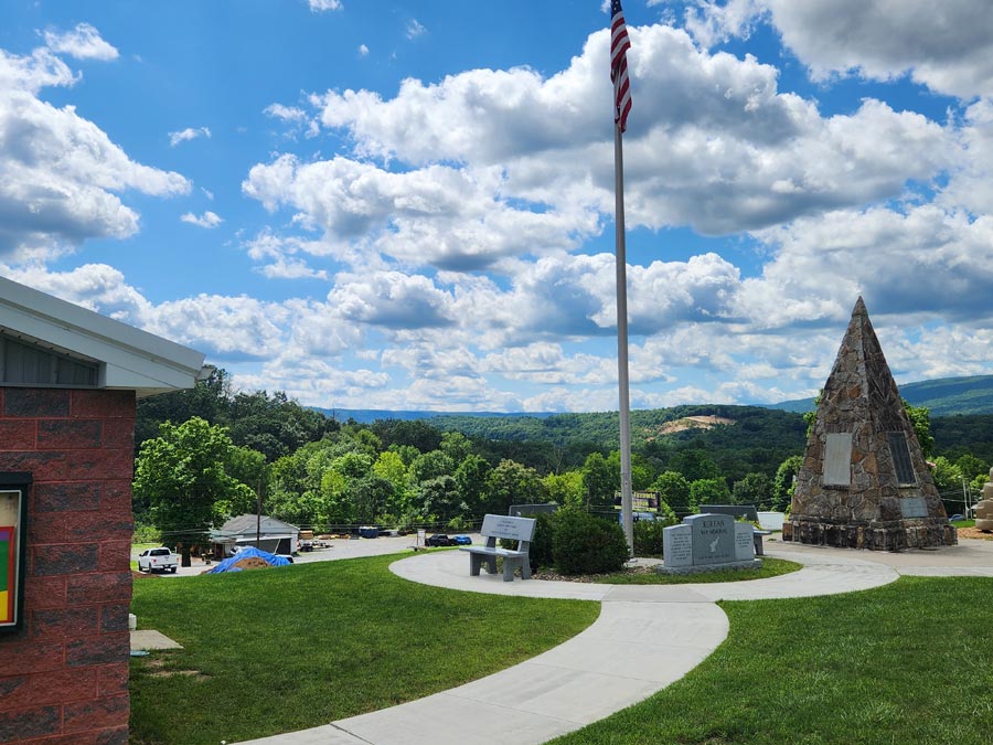 stone pyramid with plaques on it.