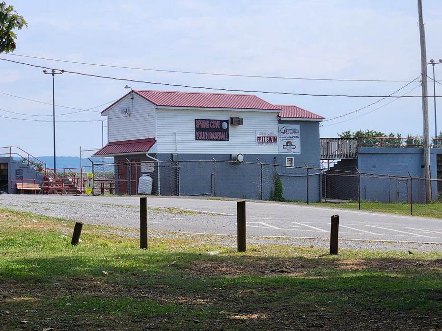 parking lot and baseball field press box building.